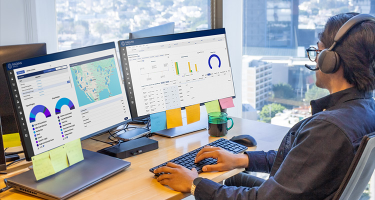 a person using Asset Management Software or a similar data analytics platform