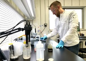  a researcher conducting material testing in a laboratory