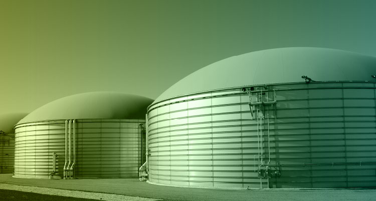 two large, cylindrical storage tanks with domed roofs