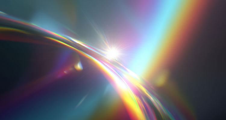 digital graphic depicting a vibrant rainbow lens flare