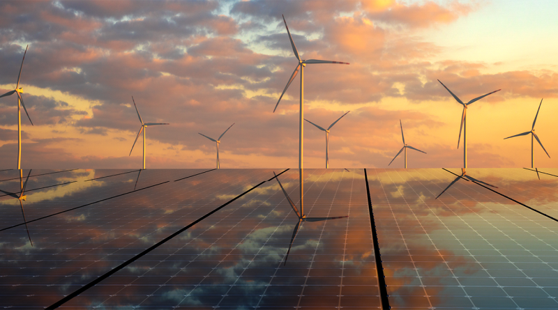 Solar panels reflecting a sunset sky with wind turbines in the background, representing the integration of solar and wind energy in the transition to clean power