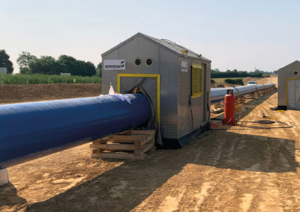 a Serimax welding cabin used for automatic pipeline welding on a construction site.
