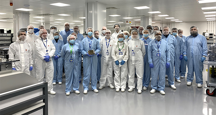 staff members from Custom Interconnect Limited (CIL) inside their cleanroom facility in Andover, UK