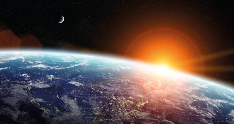 a sunrise over the curved horizon of planet Earth from outer space