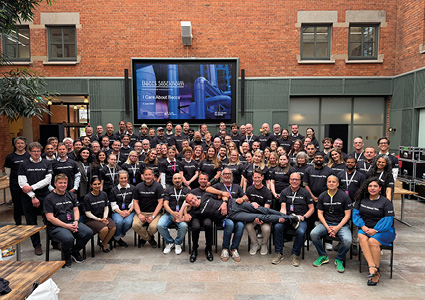the Stockholm Exergi team gathered for their BECCS celebration day outside their brick building