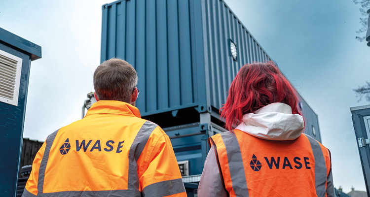 personnel wearing high-visibility gear from WASE